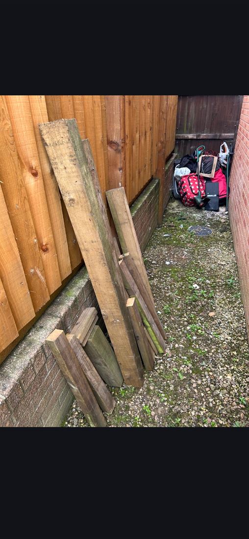 An alleyway blocked with dumped rubbish