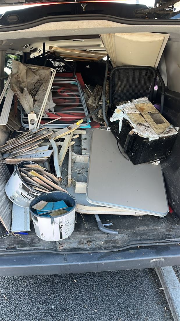 The van loaded with furniture and bags